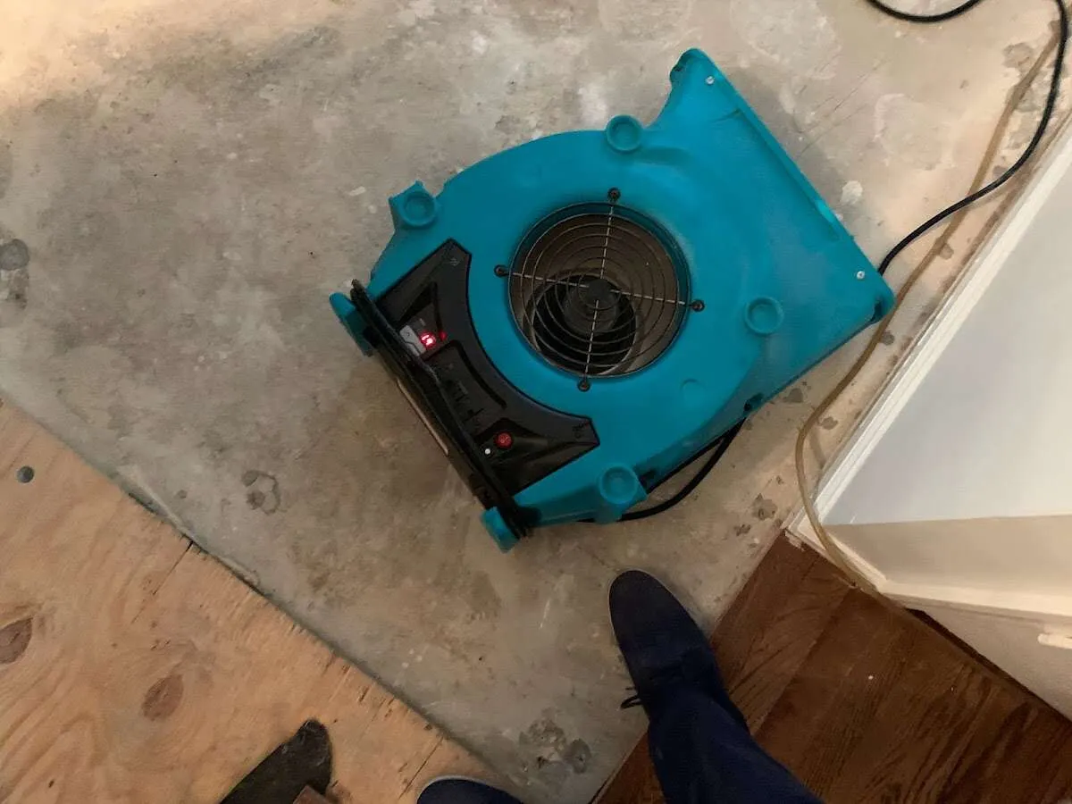 Air mover drying subfloor during Leak Detection & Repair in Upper Merion